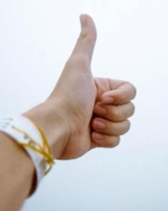 A hand with a thumbs-up gesture.