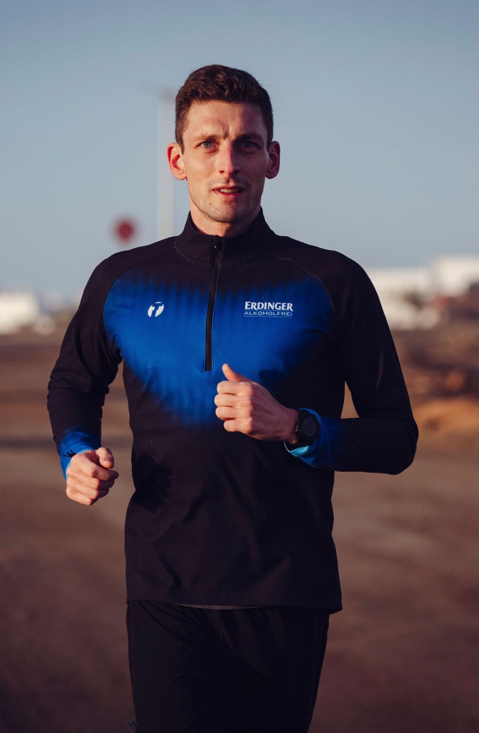 Florian Angert during his running training in the ERDINGER Alcohol-Free jersey.